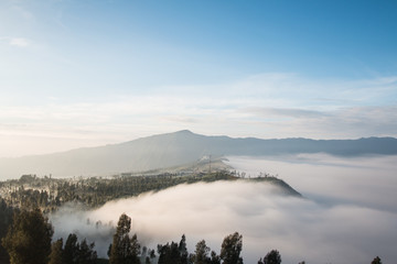 Volcano Bromo at sunset time background near Cemoro lawang village at mount Bromo in Bromo tengger semeru national park, East Java, Indonesia.