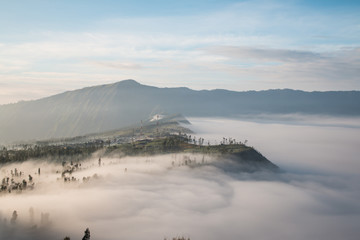 Volcano Bromo at sunset time background near Cemoro lawang village at mount Bromo in Bromo tengger semeru national park, East Java, Indonesia.