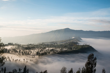 Volcano Bromo at sunset time background near Cemoro lawang village at mount Bromo in Bromo tengger semeru national park, East Java, Indonesia.