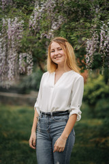 Teen girl, Young woman portrait, White shirt and blue denim jeans, Fashion, Wisteria background