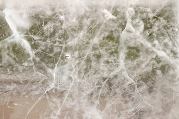 Translucent ice plate with cracks, ice winter background