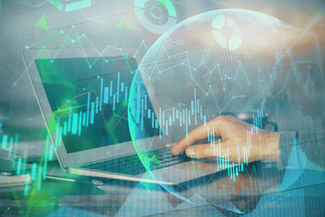 Double exposure of businessman's hands withcup of coffee with stock market graph background. Concept of research and trading.