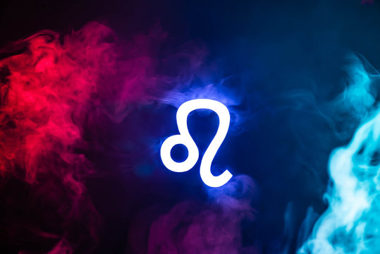 blue illuminated Leo zodiac sign with colorful smoke on background