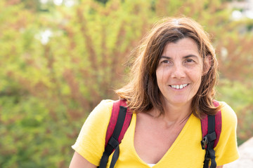 Beautiful woman tourist in park street happy laughing