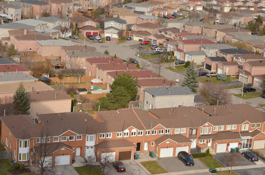 Ariel View Of Rooftops Of North American Neighborhood Town Houses . Rows Of Houses With Empty Street Can Be Seen Here. 
