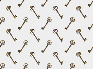 Naklejka premium seamless pattern with vintage keys on white background
