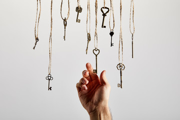 Fototapeta na wymiar top view of vintage rusty keys on white background