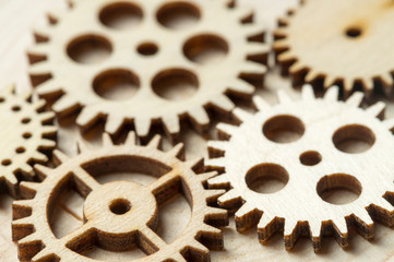 wooden gears on wooden background