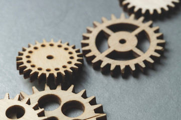 wooden gears, on a metal background, business concept