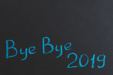 bye bye 2019, inscription on the black Board, top of the copy space