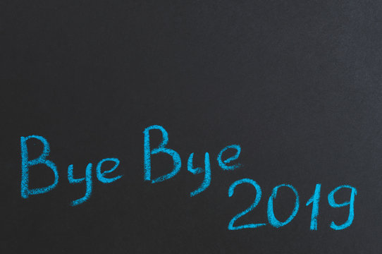 bye bye 2019, inscription on the black Board, top of the copy space