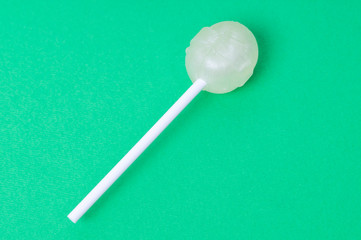 Lollipop on a green background, children's sweets