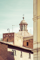 Fototapeta na wymiar Rooftops in Rome with church dome