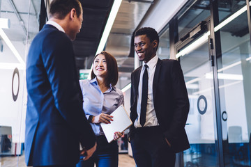 Diverse coworkers talking to boss