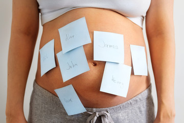 Belly of a pregnant woman with stickers