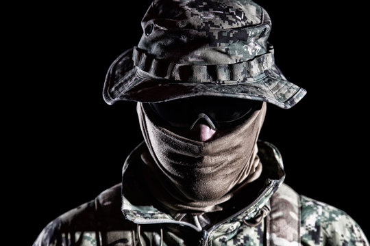 Elderly commando fighter studio portrait on black
