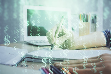 Financial forex charts displayed on woman's hand taking notes background. Concept of research. Double exposure
