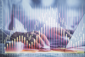 Double exposure of forex graph with man working on computer on background. Concept of market analysis.