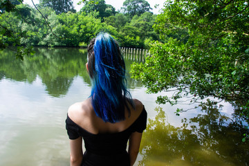 Fototapeta premium A girl looking at the lake