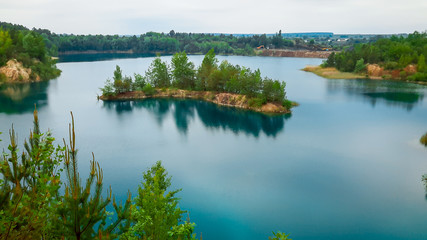 small island in a bay or quarry with water