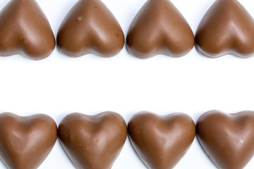 marshmallow chocolate in heart shape on white background with copyspace