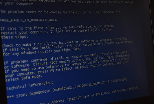 Computer error failure concept,  failure message on screen, bad software pc app crash, email malware, data loss and recovery, rear view over the shoulder Business laptop or office notebook computer PC