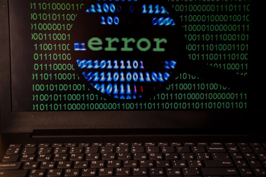 Computer error failure concept,  failure message on screen, bad software pc app crash, email malware, data loss and recovery, rear view over the shoulder Business laptop or office notebook computer PC