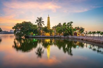 Panorama scene of Tran Quoc pagoda, the oldest temple in Hanoi, Vietnam, with brilliant sunset - obrazy, fototapety, plakaty