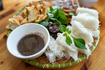 Vietnamese traditional plate pork vermicelli tofu (Bun Dau Mam Tom), the popular lunch set in...