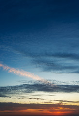 Obraz premium Fantastic clouds at sunrise, vertical panorama