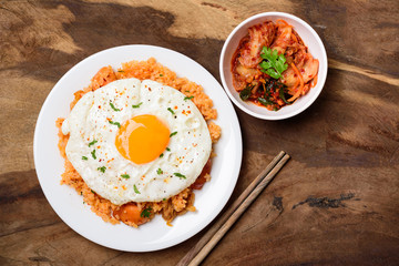 Kimchi fried rice with fried egg and cabbage kimchi, Korean food