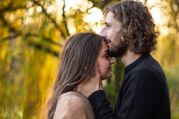 Fototapeta premium Happy couple outdoors. Outdoor portrait of romantic couple in love. Full of happiness. 