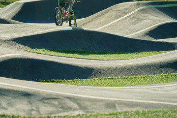 bicicle on a pump track park. Asphalted bicycle race track, pump track, kids playground