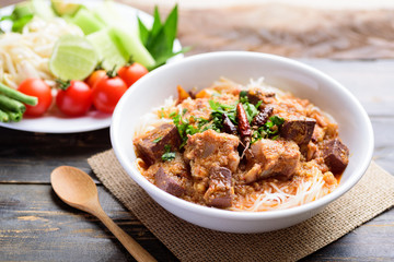 Northern Thai food (Kanom Jeen Nam Ngeaw), rice noodles with spicy soup eating with vegetables