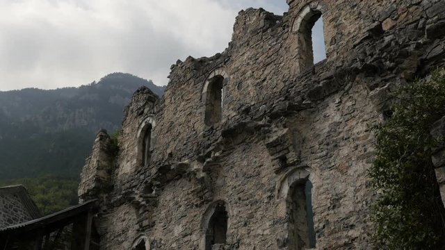 Walls of Agios Dionysios monastery on top of the Olympus mountain 4K panning footage