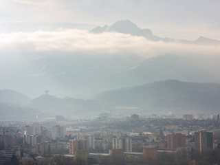 View over the city of Innsbruck, Austria on a hazy winter afternoon