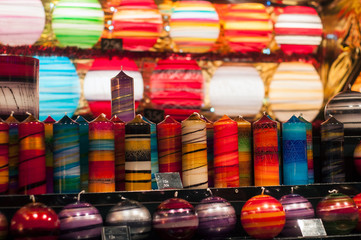 Closeup of colorful candles for sale at the christmas market