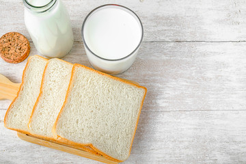 Breakfast a glass of milk and bread on the table