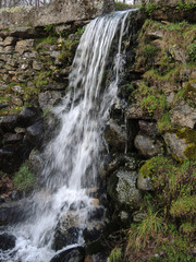 Naklejka na ściany i meble A small waterfall near Bohoyo in the Sierra de Gredos. Province of Ávila. Castile and Leon Spain