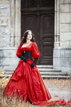 Woman in a red Victorian dress