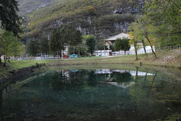 Fototapeta premium wonderful view of the lake and mountain. particular colour of the lake gives a perfect reflection of the landscape