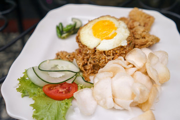 Stir fried rice with egg and salad vegetable cucumber and crackers