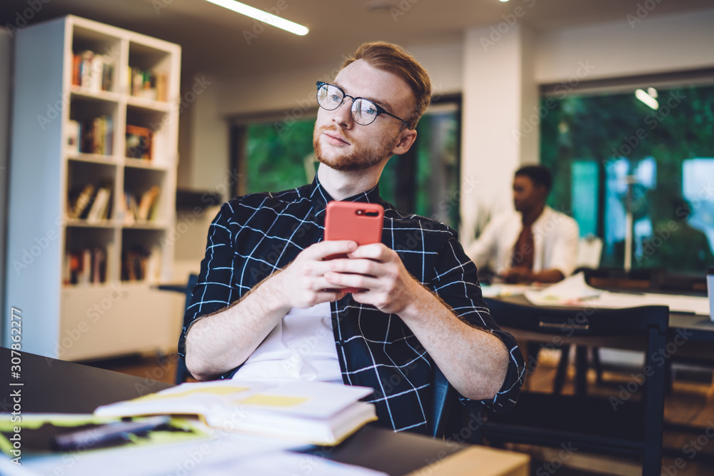 Poster thoughtful millennial blogger pondering on comments from personal website page during time for knowl
