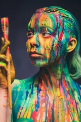 Foto auf Glas Young woman covered with a colourful paint © Nejron Photo