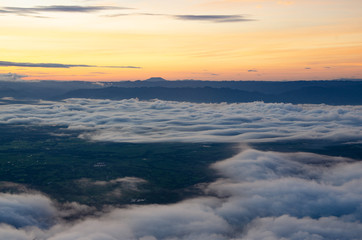 Fototapeta na wymiar The sunrise on the mountain in the morning with the sea of fog