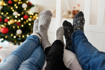 Close up of familyâ€™s legs in warm socks