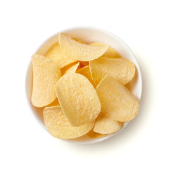 Potato chips in bowl isolated on white background. Top view.