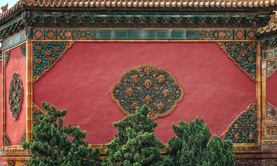 wall with decorations at the gate in the Imperial palace (Forbidden City). Oriental architectural...