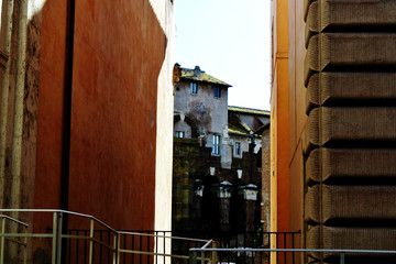 cityscape with a view between two buildings to the old town on a Sunny day