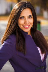 Happy business woman in autumn park